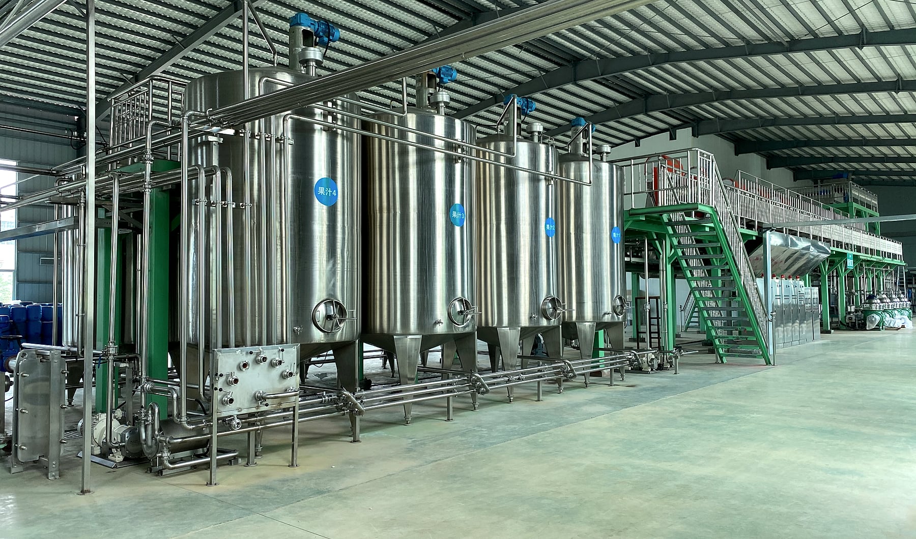 Real CIP tank line and stainless support equipment in a processing workshop