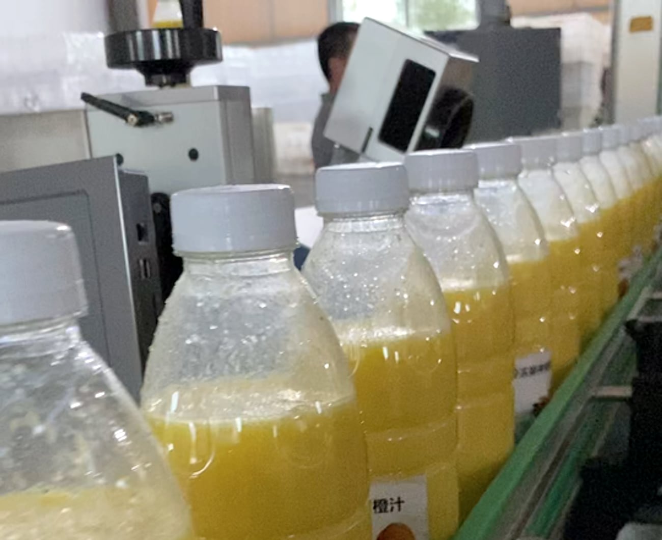 Finished bottle packaging output after filling and downstream handling